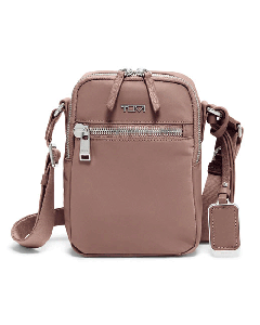 TUMI's Voyageur Mauve Persia Cross Body Bag has a front zip pocket with an internal key leash.